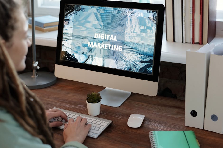 Close-up of a woman working on a digital marketing project in a home office setting